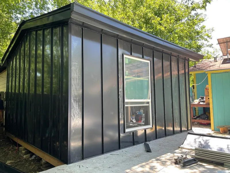 Black standing seam metal wall panels for Roof Inspection in North Charleston