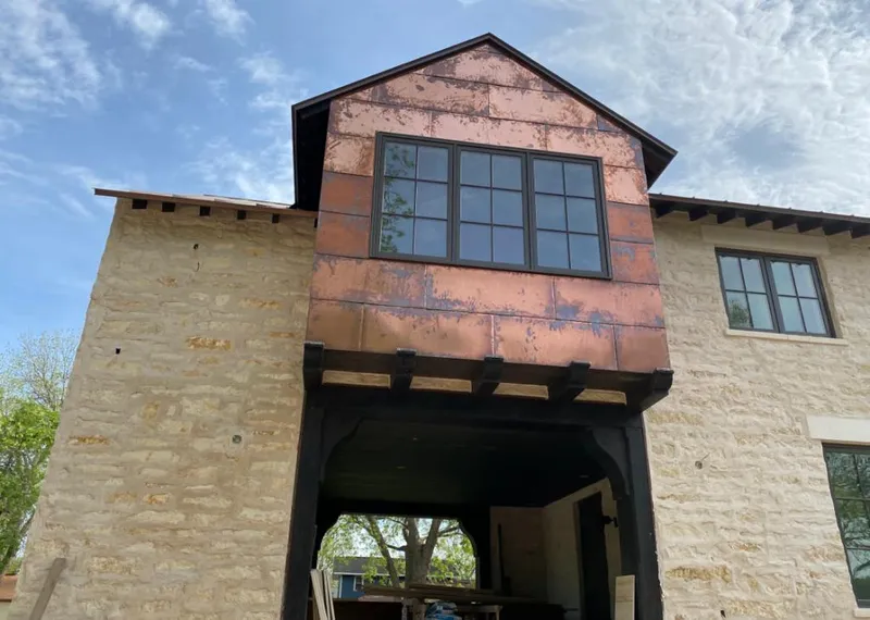 Copper metal panel facade on a stone building for Roof Repair in North Charleston