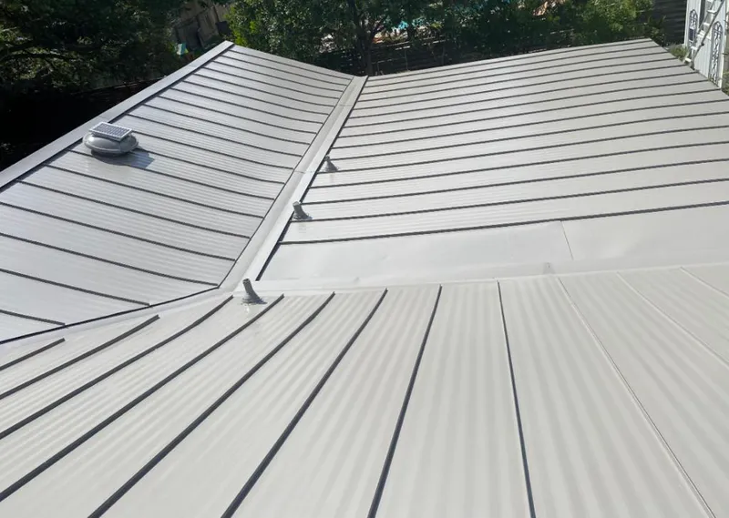 Solar attic fan installed on a metal roof for Roof Ventilation in North Charleston